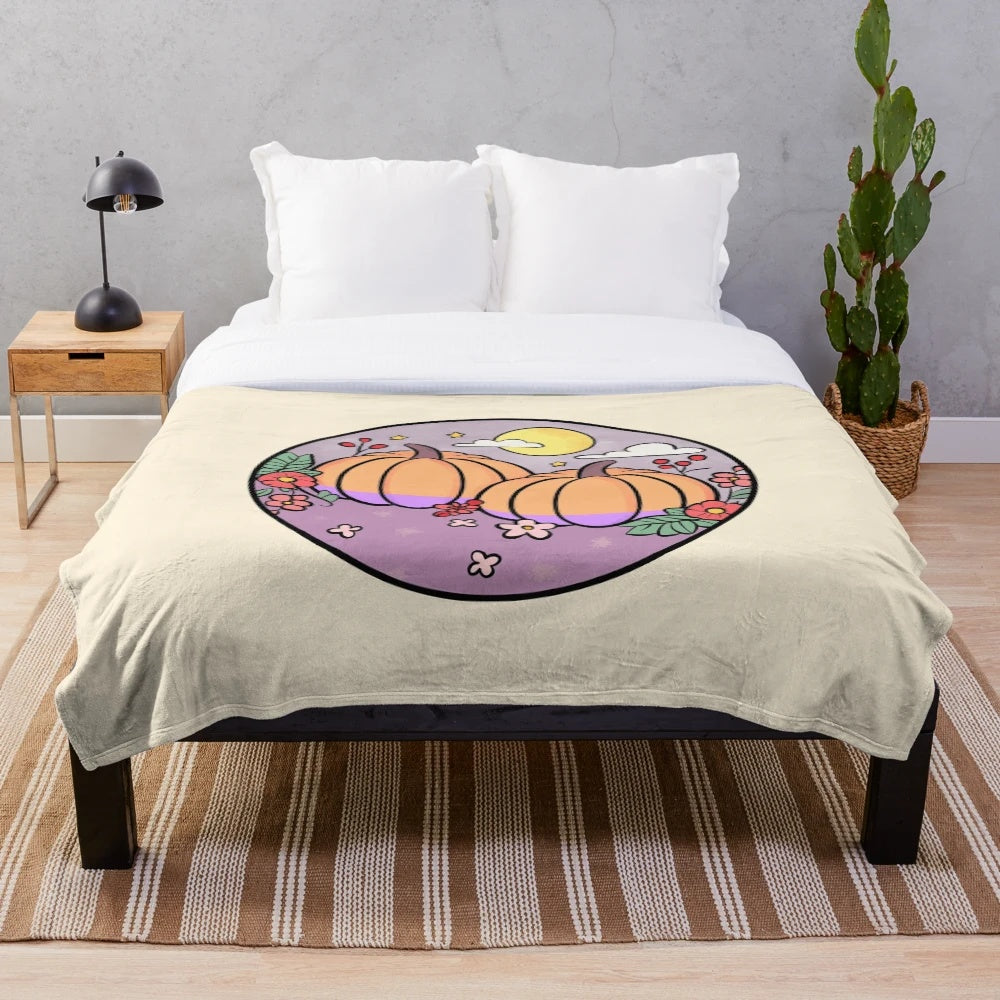 Soft and plush pumpkin-themed blanket with fall aesthetic design