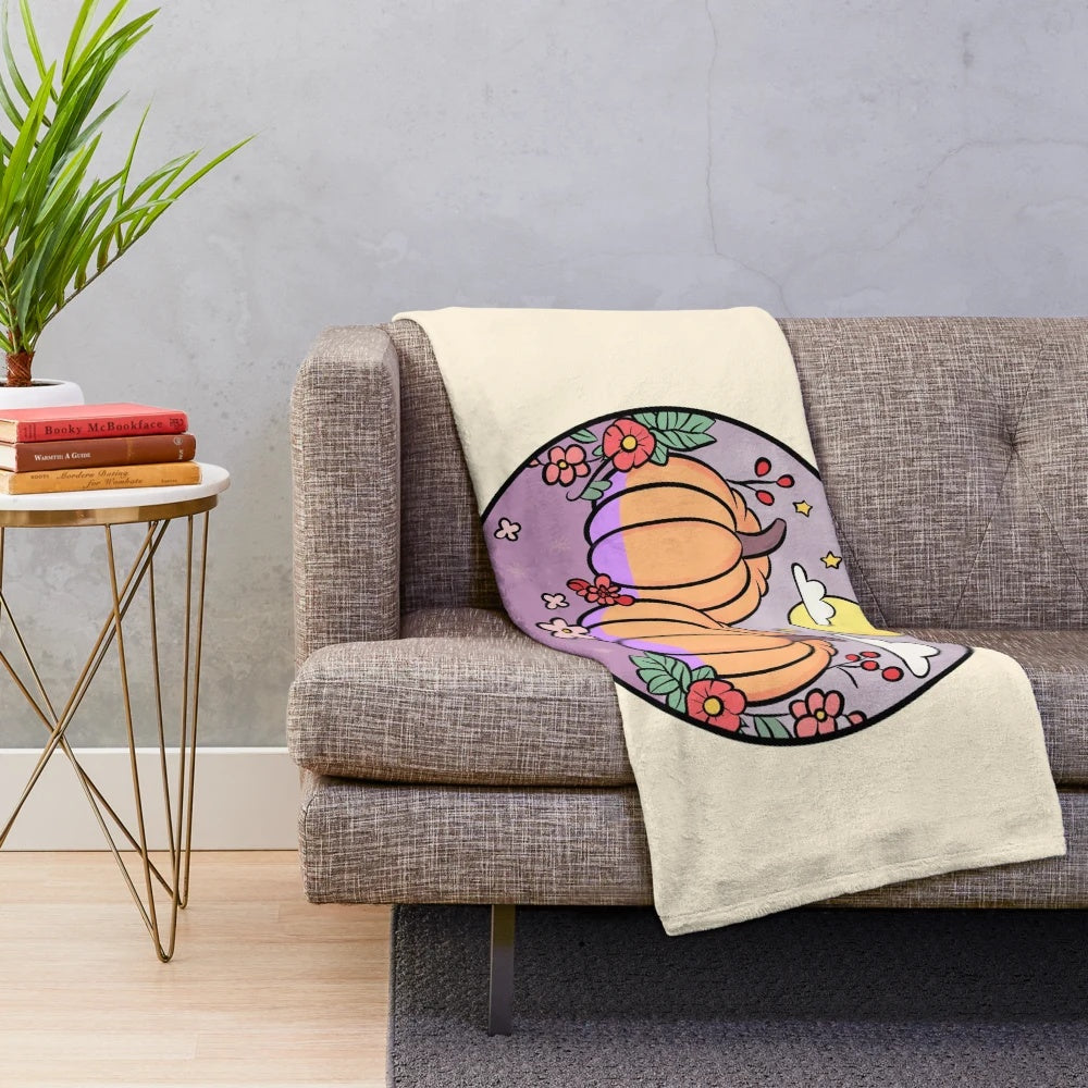 Soft and plush pumpkin-themed blanket with fall aesthetic design