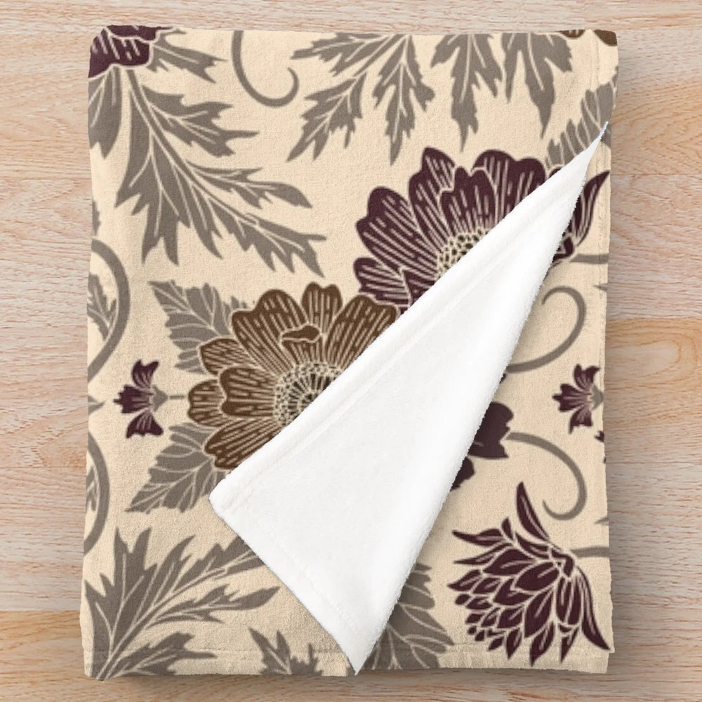 Soft and plush floral pattern blanket in autumnal colors of mauve and brown