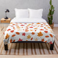 Fall leaves pattern on a soft, plush blanket