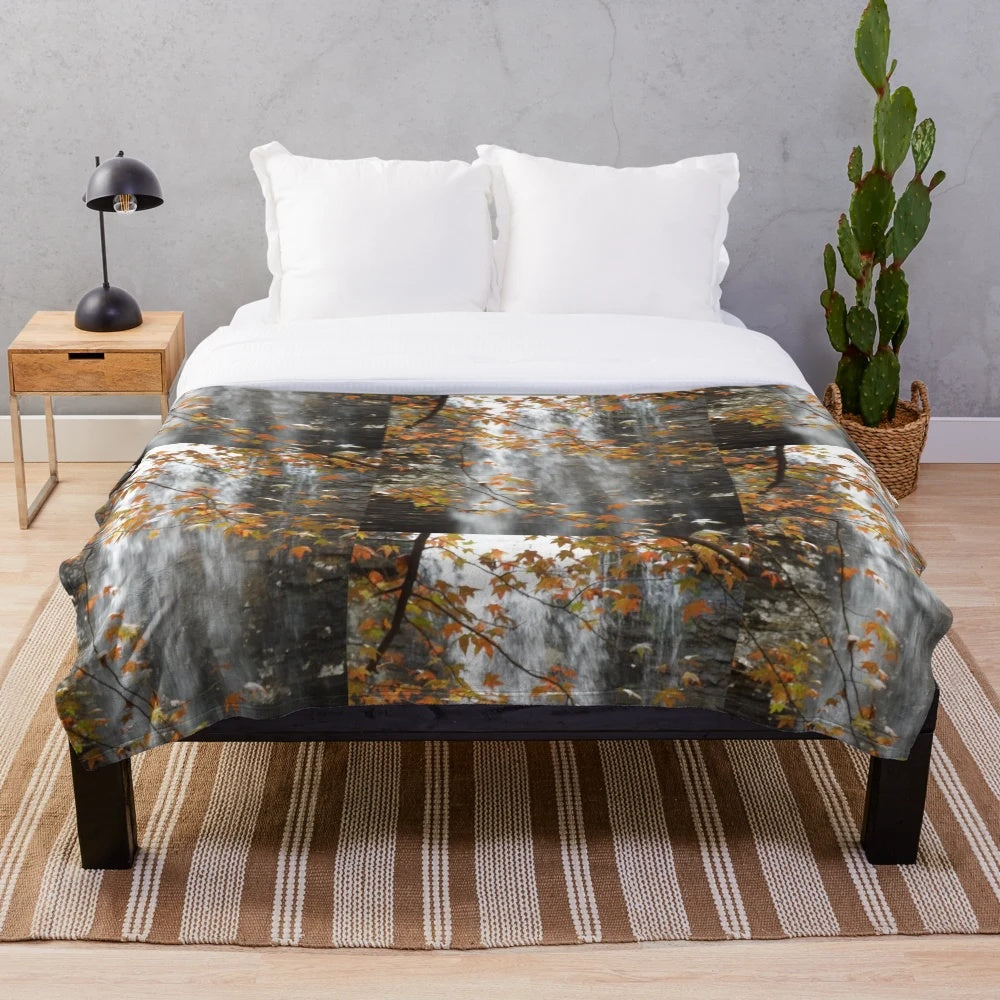 Plush blanket with fall leaves and waterfall design