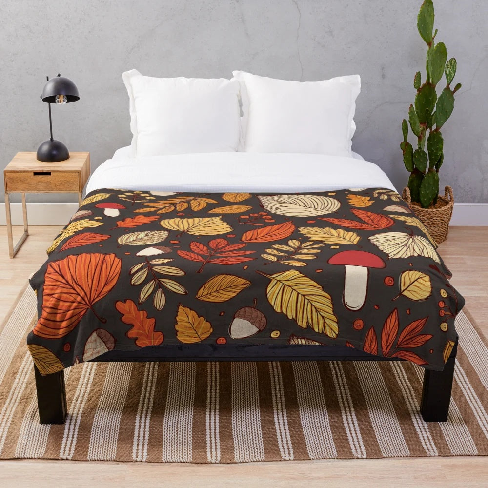 Cozy fall pattern plush blanket with leaves, mushrooms, and acorns design
