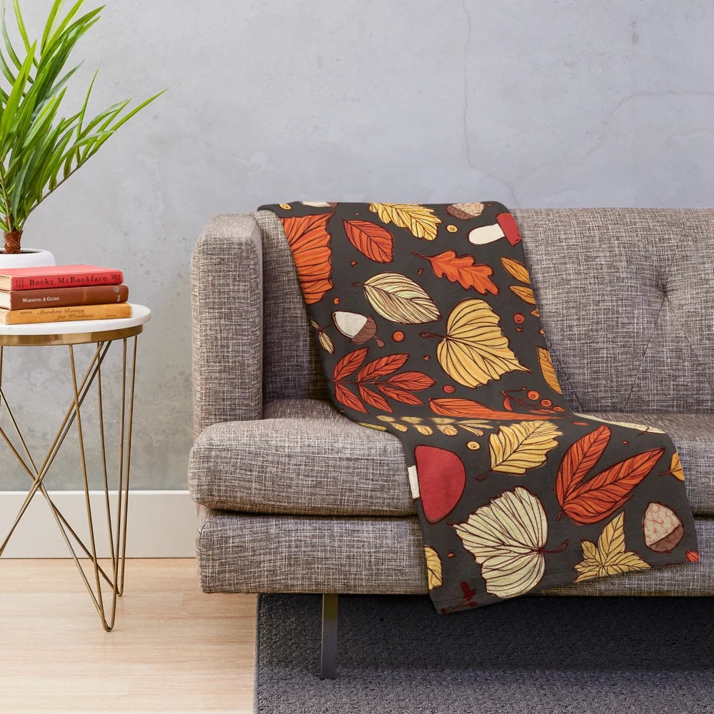 Cozy fall pattern plush blanket with leaves, mushrooms, and acorns design