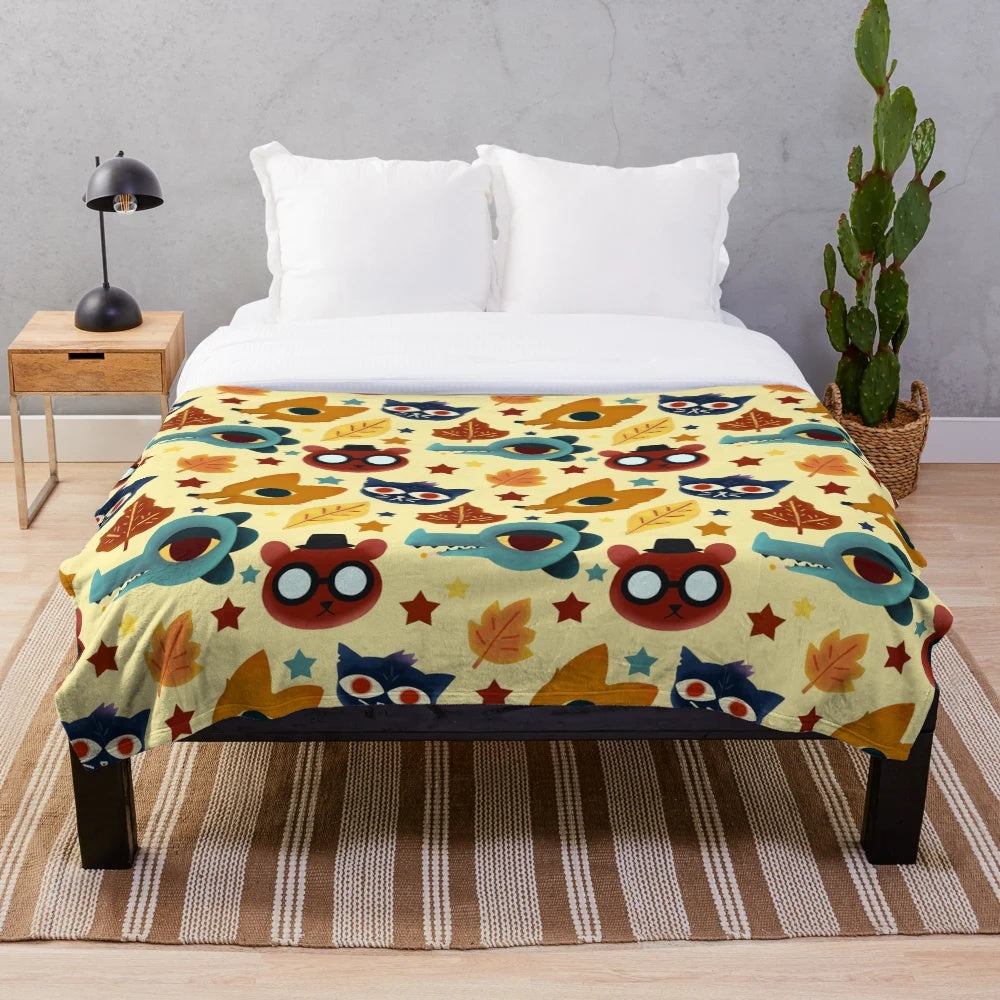 Plush blanket with a colorful fall pattern design inspired by the video game Night in the Woods