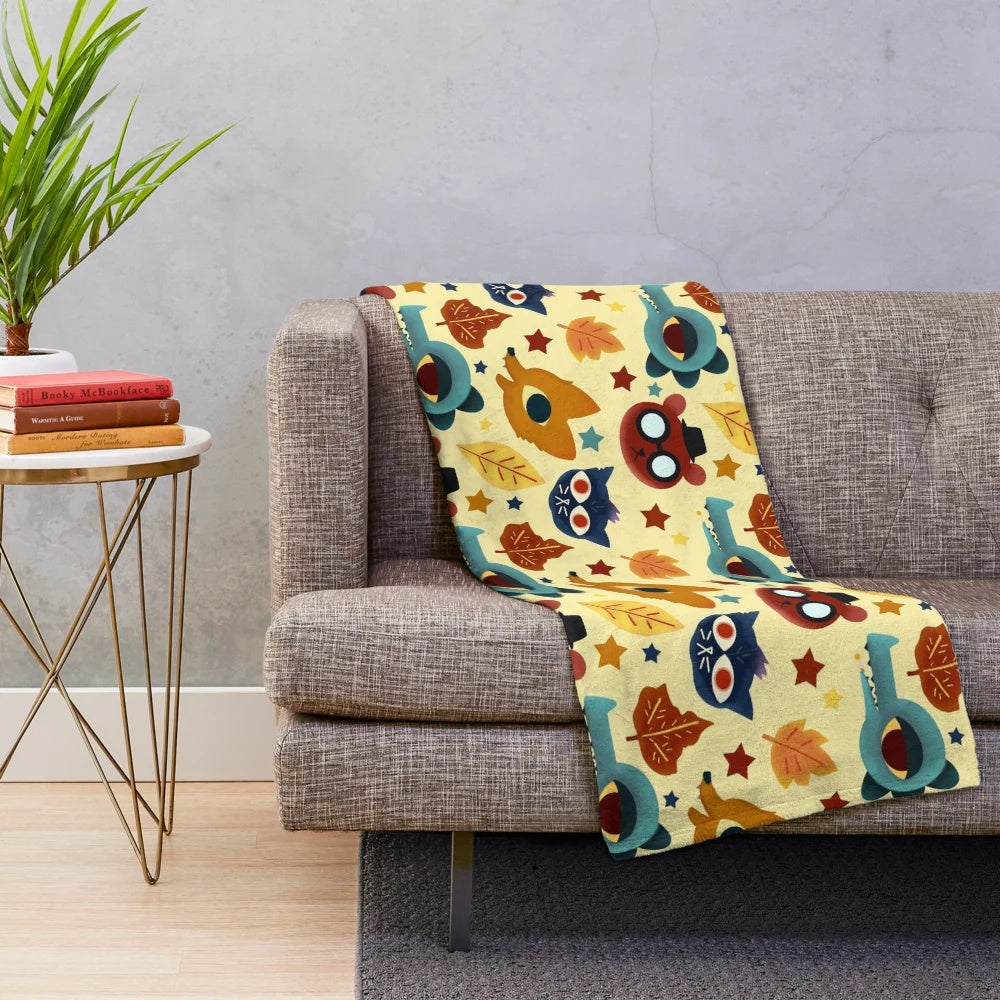Plush blanket with a colorful fall pattern design inspired by the video game Night in the Woods