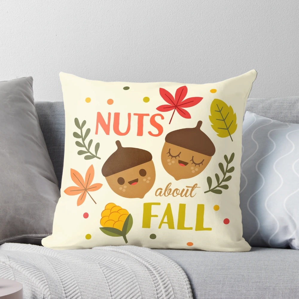 Decorative fall pillow with a charming acorn and leaf design, perfect for seasonal home accents.