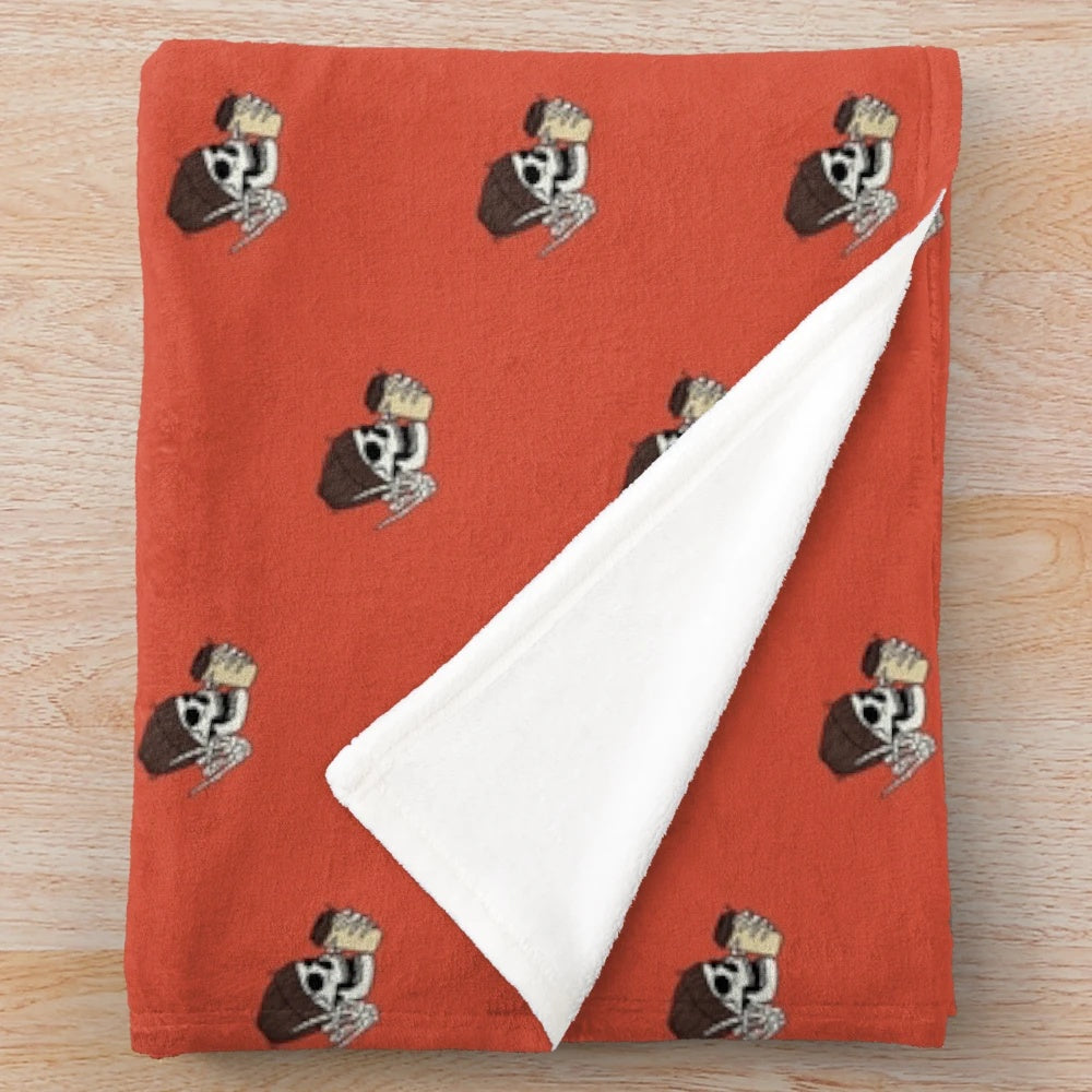 Soft and plush fall-themed blanket with pumpkin, coffee, and skeleton design