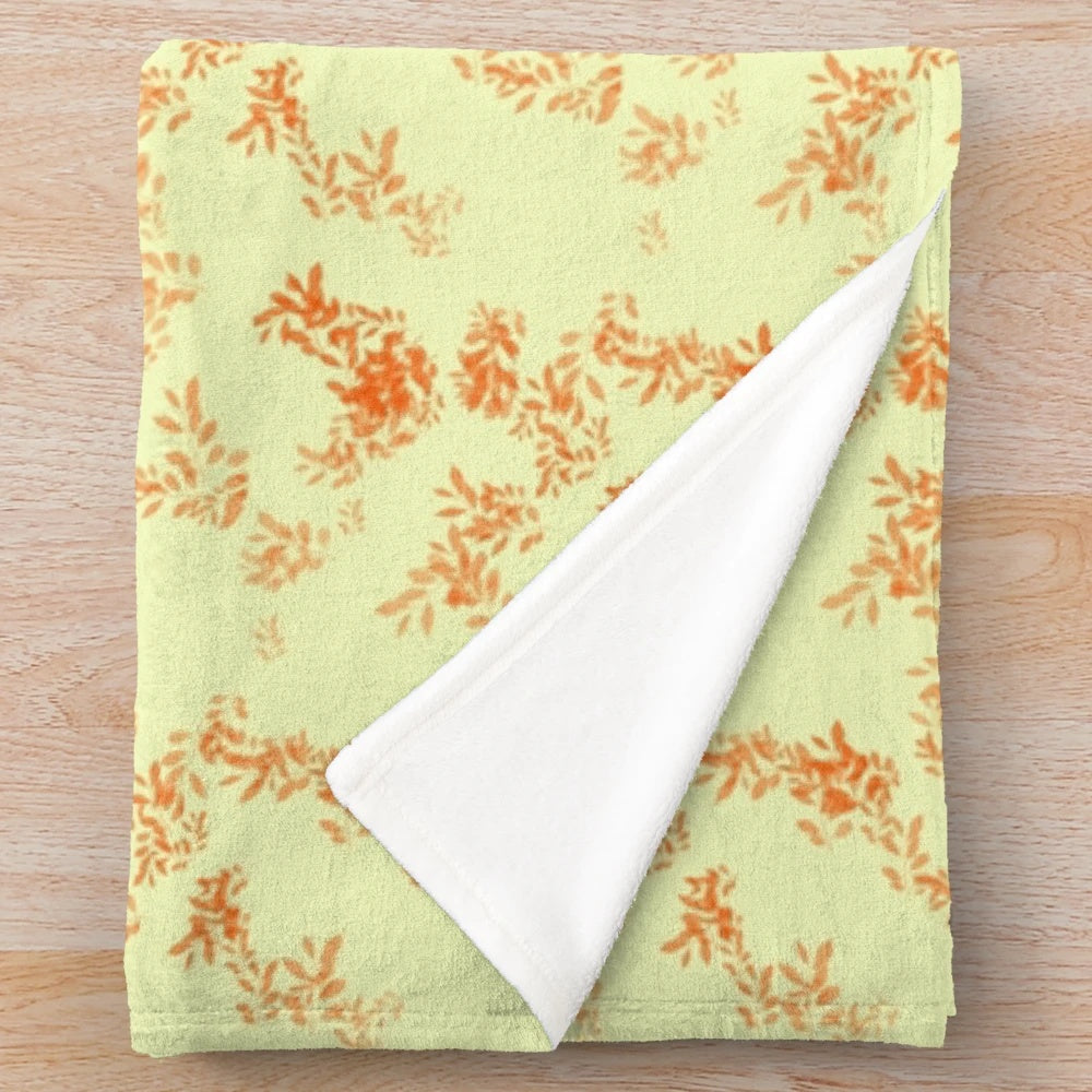 Soft and cozy fall plush blanket in warm colors