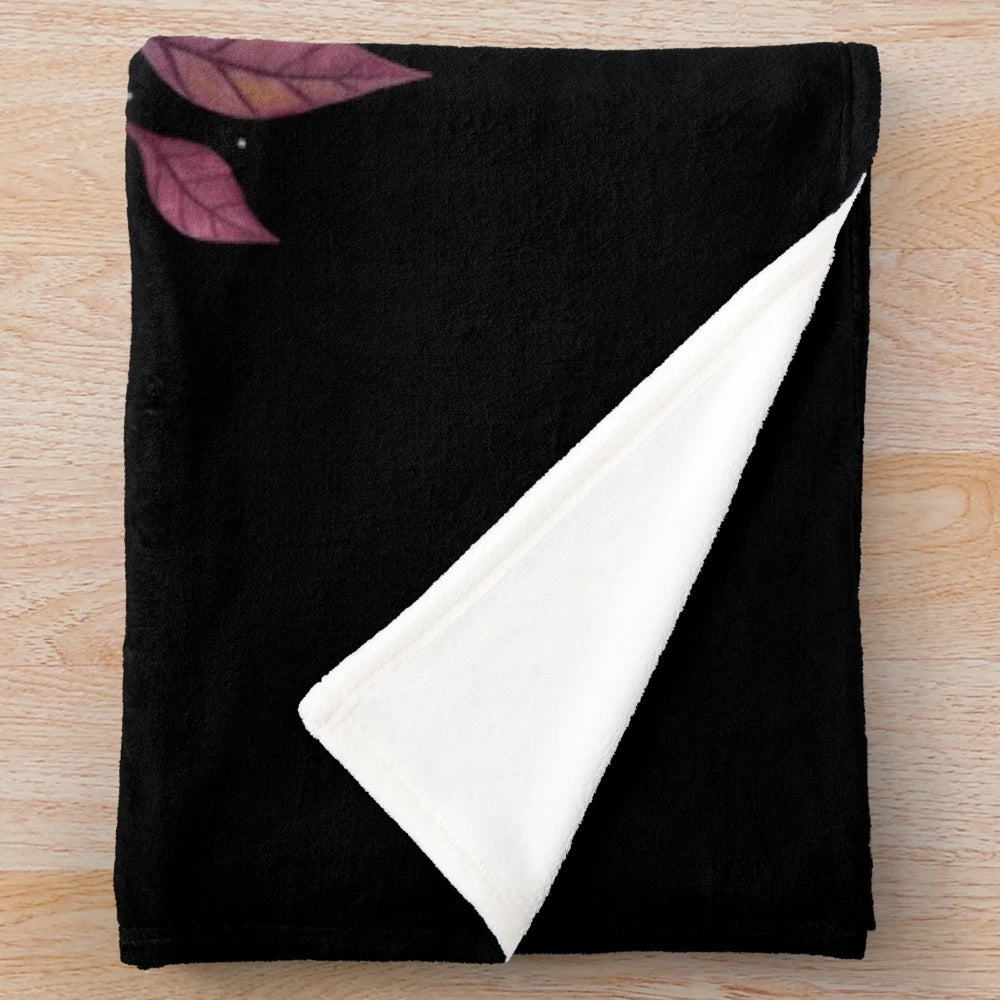 Soft and plush fall-themed blanket with botanical and witchy design elements