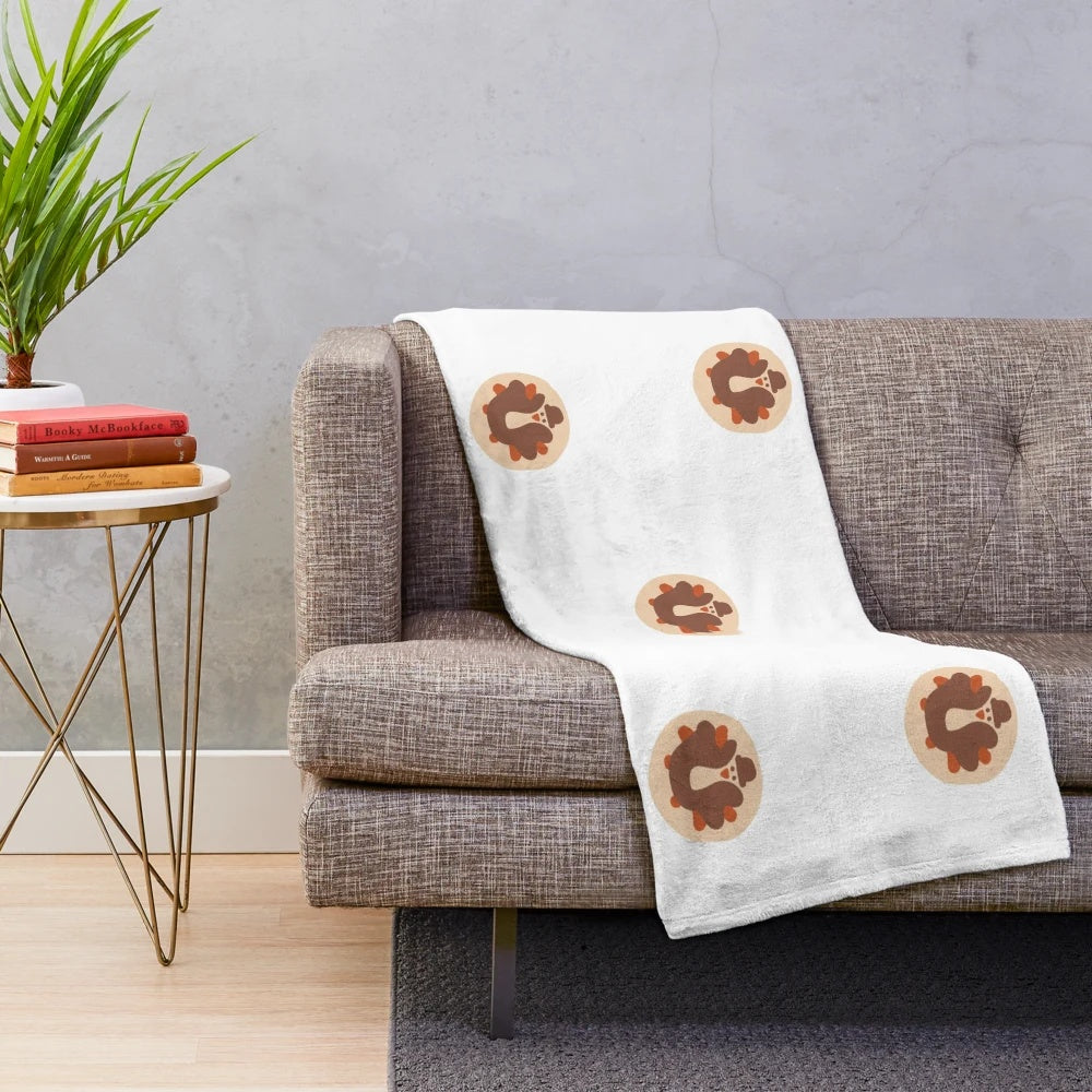 Plush blanket with fall-themed turkey cookie design