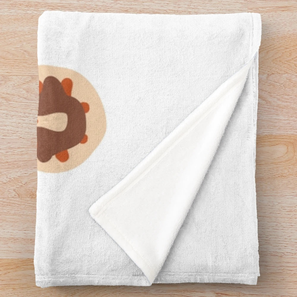 Plush blanket with fall-themed turkey cookie design