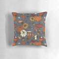 Cozy fall-inspired pattern pillow featuring pumpkins, leaves, and other autumnal elements