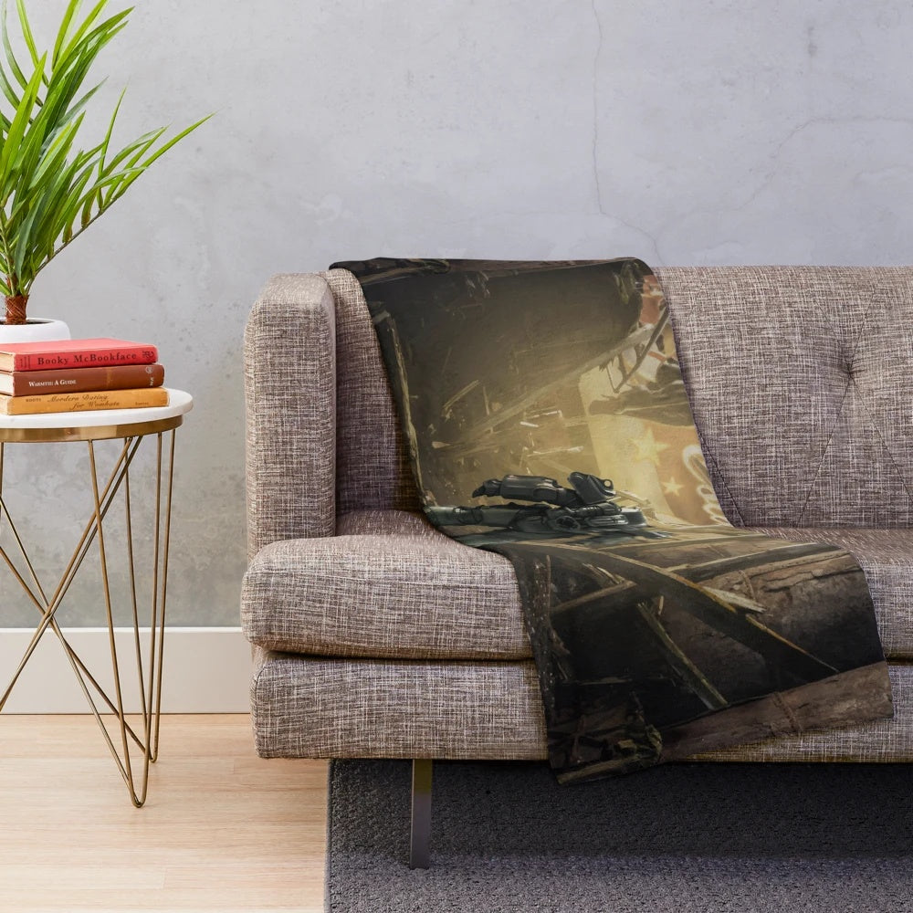 A plush blanket featuring Fallout-inspired design elements like Nuka Cola and Vault Tech logos