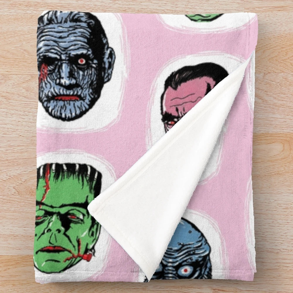 Famous Monsters plush blanket featuring iconic horror characters