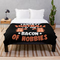 Plush blanket with a fantasy football and bacon themed design