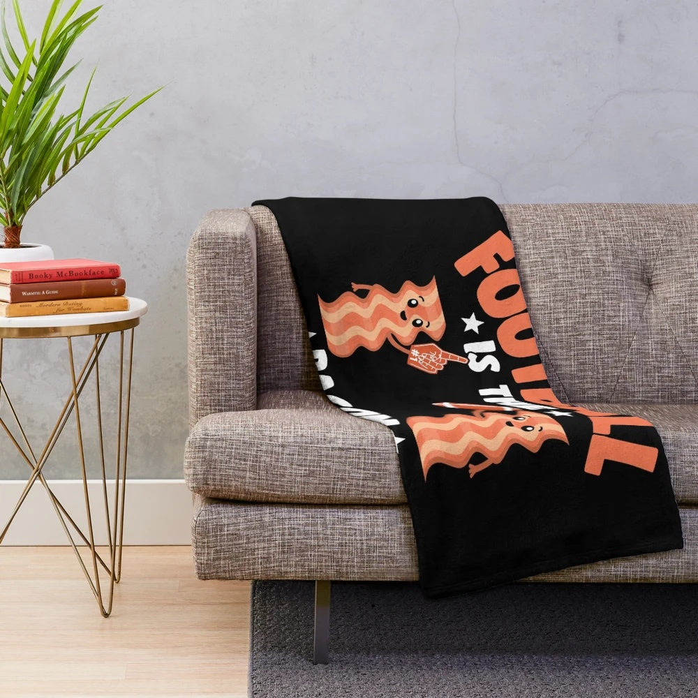 Plush blanket with a fantasy football and bacon themed design