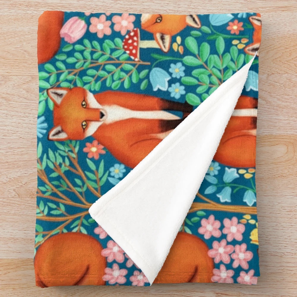 Soft and plush blanket featuring a fantasy forest design with cute woodland animals like foxes and dogs.