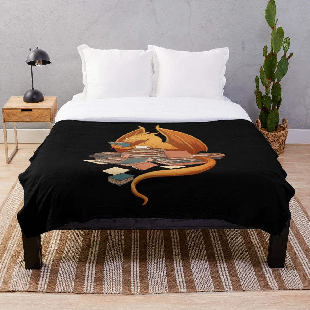 Cozy fantasy literature plush blanket with dragon, books, and library design