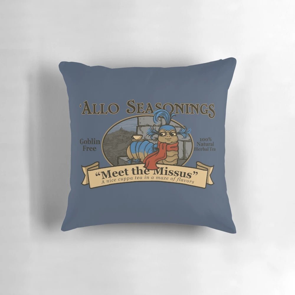 A plush, decorative pillow featuring a labyrinth design with a whimsical worm character, perfect for tea enthusiasts and 80s fantasy fans.