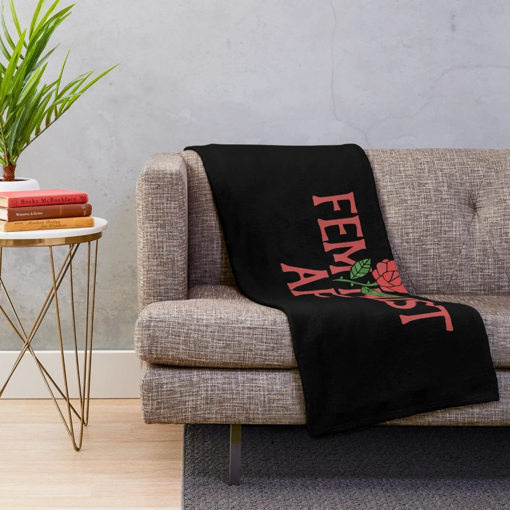 Feminist-themed plush blanket with rose pattern design