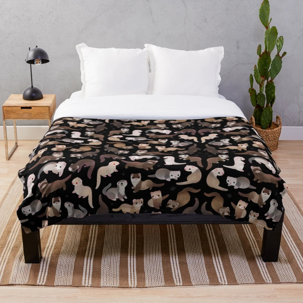 Soft and cuddly plush blanket featuring a dark sable ferret design