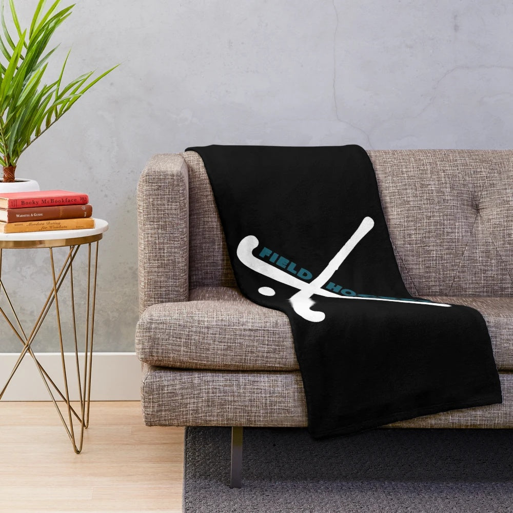 Field hockey plush blanket with sports equipment design