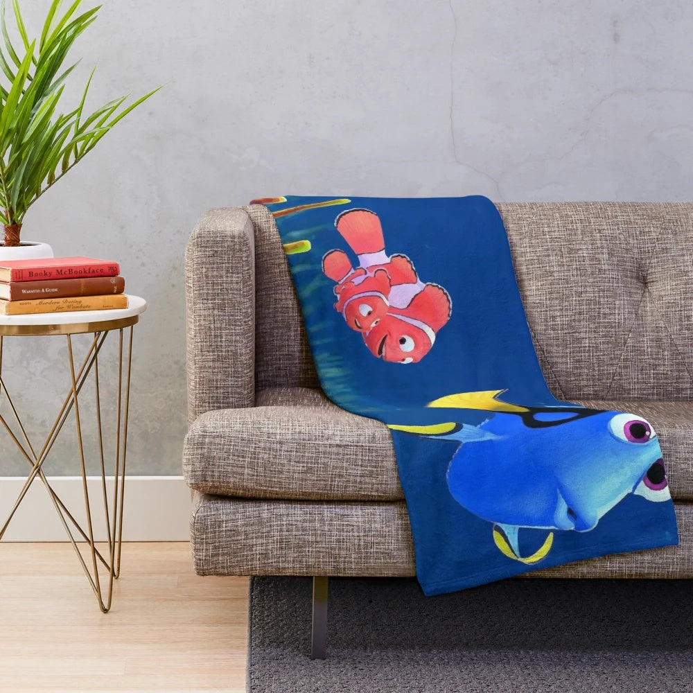 A plush and soft blanket featuring the character Nemo from the Disney Pixar movie Finding Nemo