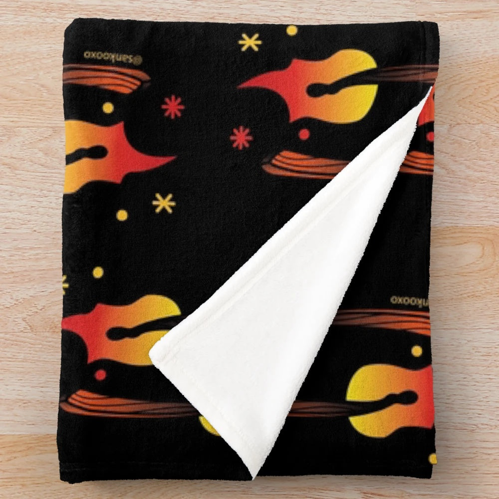 A soft and plush fire-themed blanket for a cozy and warm atmosphere