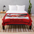 Plush blanket featuring a firetruck design inspired by the 1970s TV show 'Emergency!