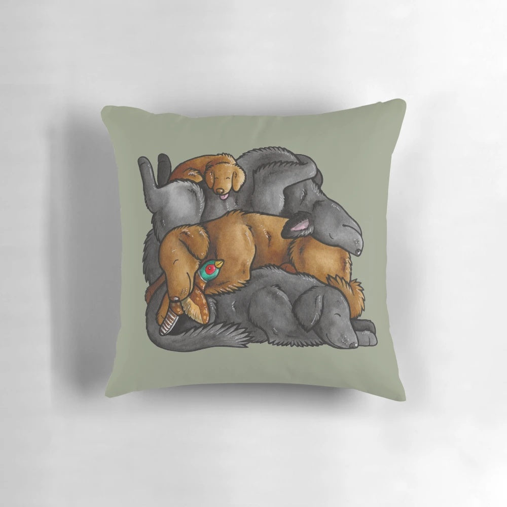 A soft, plush pillow featuring a sleeping pile of flat-coated retriever dogs