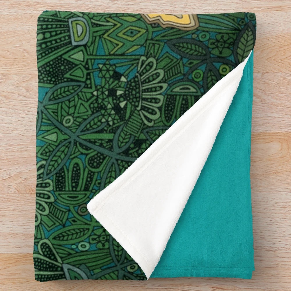 Floral fox plush blanket with botanical, geometric, and tribal patterns in teal, turquoise, and green colors
