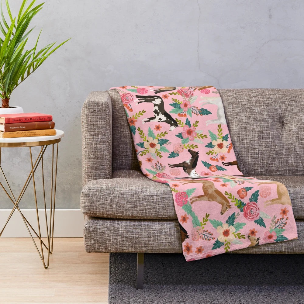 Soft and warm plush blanket featuring a floral pattern with different horse breeds