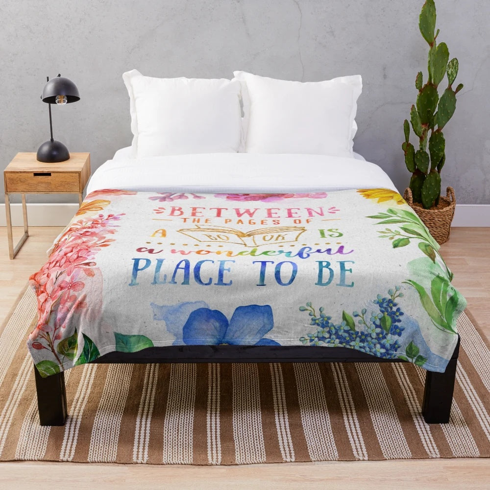 Vibrant watercolor floral pattern plush blanket for cozy reading and relaxation
