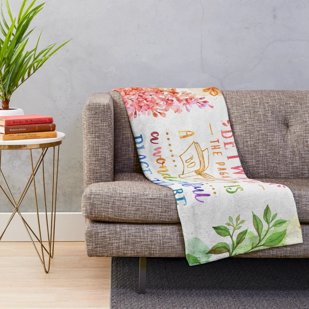 Vibrant watercolor floral pattern plush blanket for cozy reading and relaxation