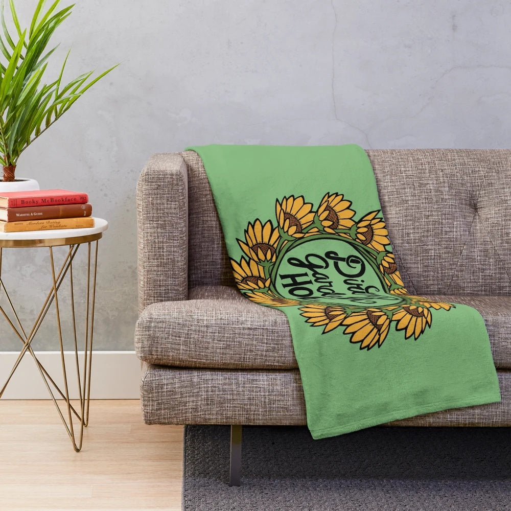 Gardening-themed plush blanket with floral design