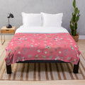 Colorful spring flowers and biking design on a plush blanket