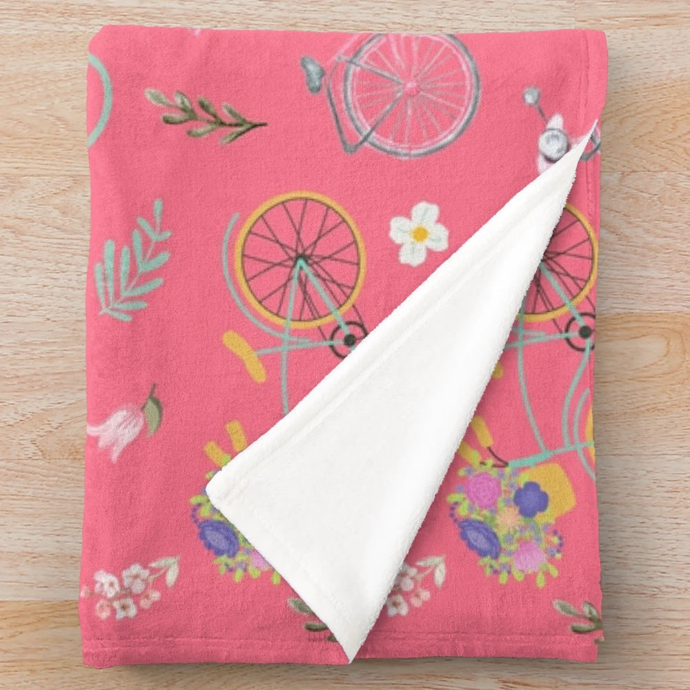Colorful spring flowers and biking design on a plush blanket