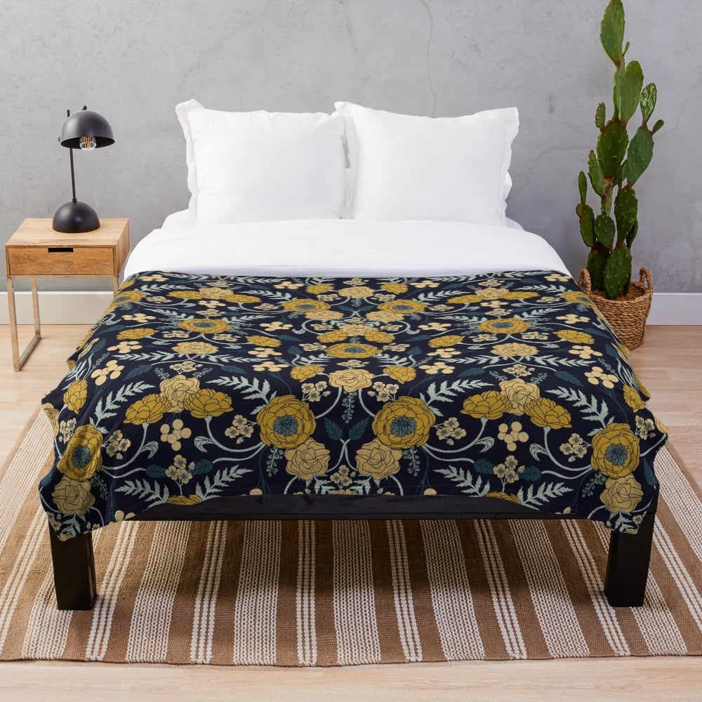 Navy blue, turquoise, cream and mustard yellow floral patterned plush blanket
