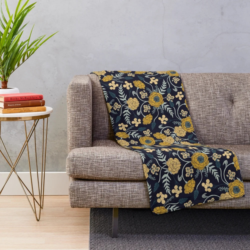 Navy blue, turquoise, cream and mustard yellow floral patterned plush blanket