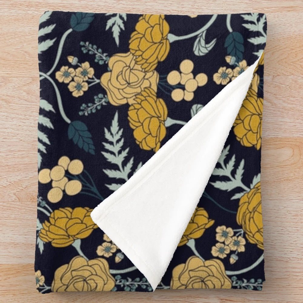 Navy blue, turquoise, cream and mustard yellow floral patterned plush blanket