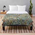 Plush blanket with a floral design inspired by the artwork of William Morris