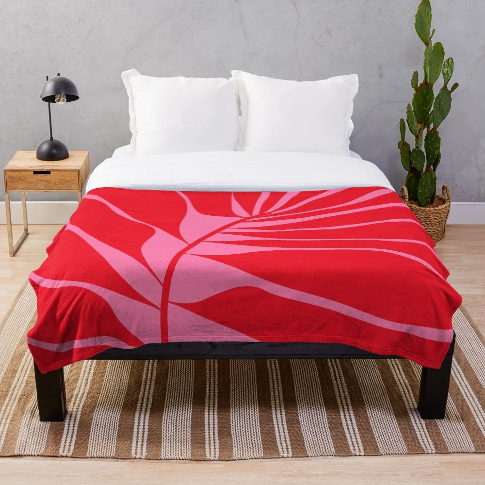 Pink and red leaf patterned plush blanket
