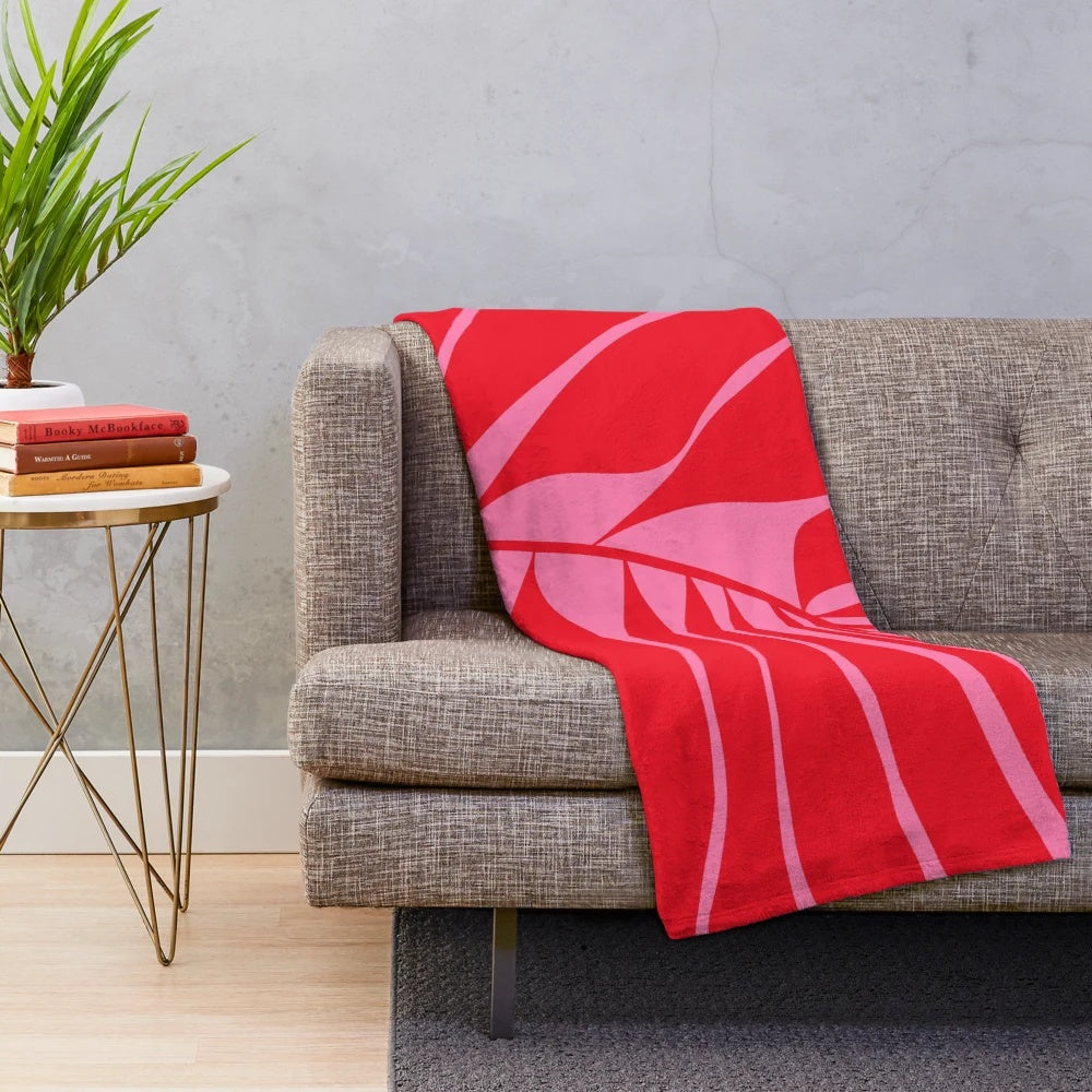 Pink and red leaf patterned plush blanket