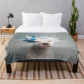 Soft and fluffy plush blanket featuring a polar bear with a floral crown design