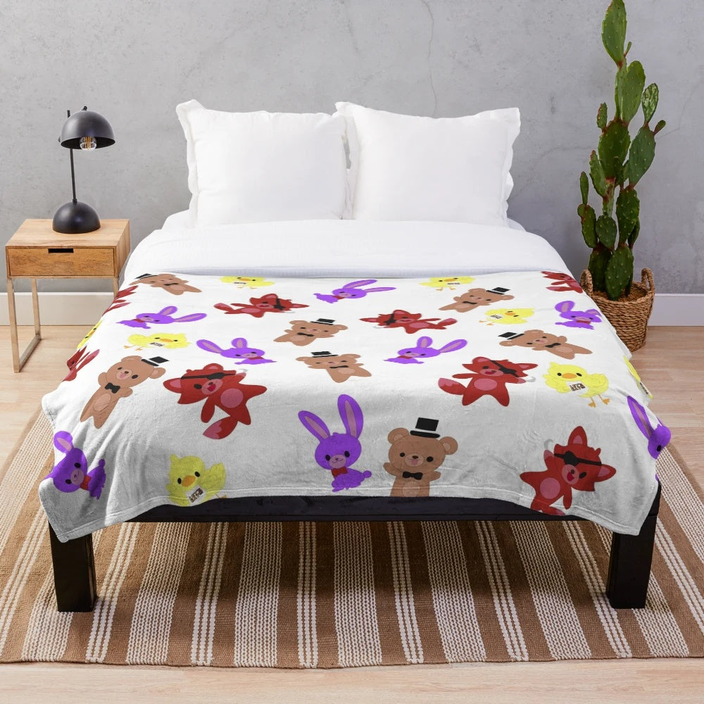 Cozy FNAF-inspired plush blanket with a cute, whimsical pattern featuring Freddy, Bonnie, Chica, and Foxy.