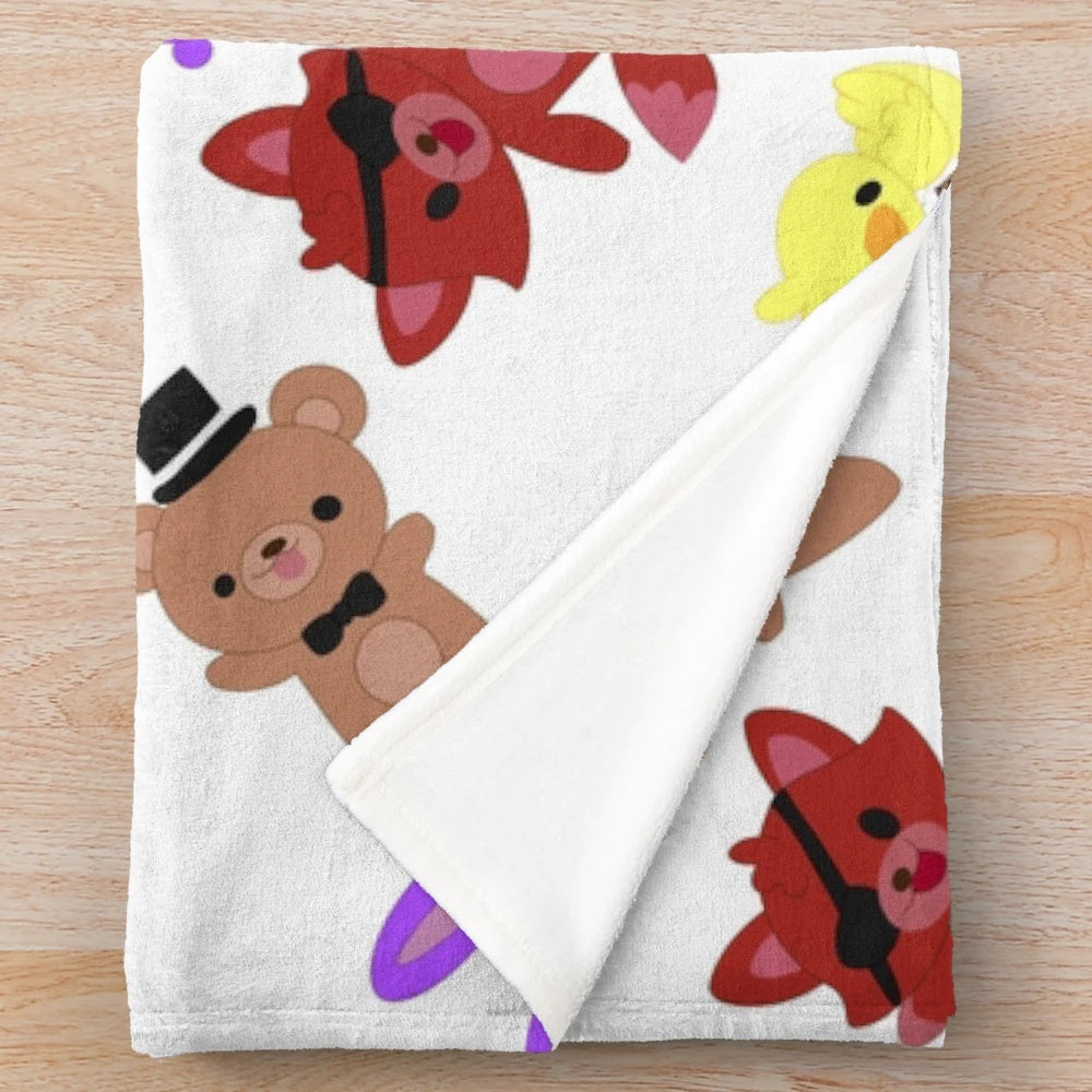 Cozy FNAF-inspired plush blanket with a cute, whimsical pattern featuring Freddy, Bonnie, Chica, and Foxy.