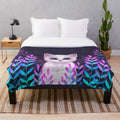 Plush blanket with a foliage design and celestial accents