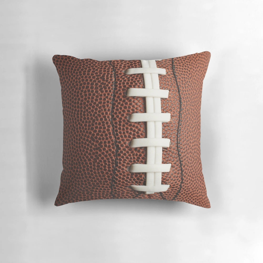 Soft, plush football-shaped pillow for home decor and sports enthusiasts