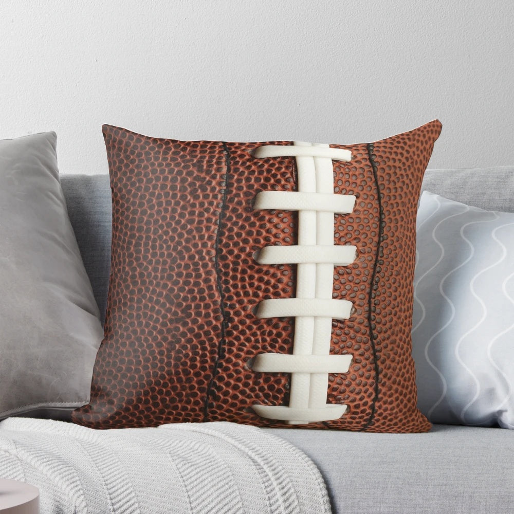 Soft, plush football-shaped pillow for home decor and sports enthusiasts