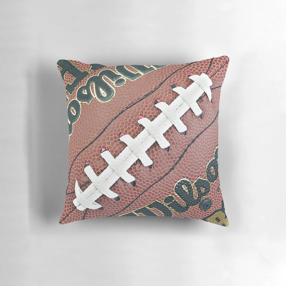 A comfortable throw pillow featuring a football design, perfect for decorating a man cave or sports-themed space.